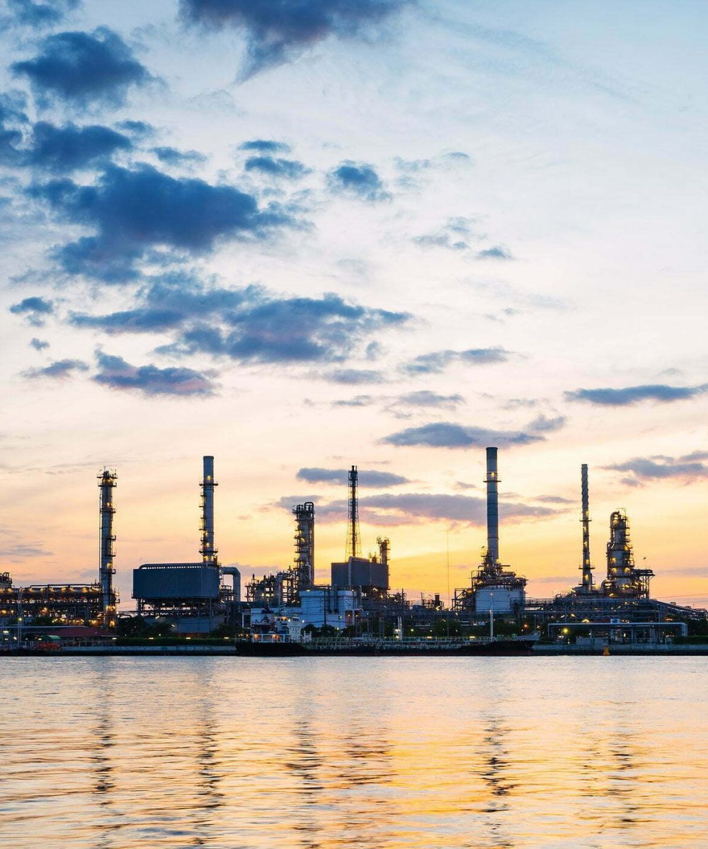 river side oil refinery industry plant along twilight morning,chao-praya river bangkok